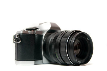 Fototapeta premium Retro camera with metal lens on white background