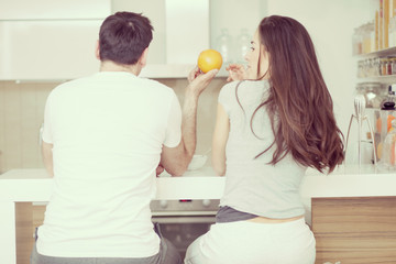 Beautiful young couple  take breakfast cereals in the kitchen