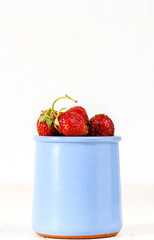 strawberry in a blue jar
