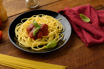 Spaghetti with tomato sauce and their ingredients around .Adjustment size for banner, cover and header.