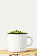 Fresh peas in iron bowl