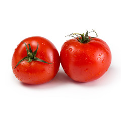 Ripe red tomatoes isolated on white background