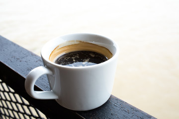 A cup of coffee near the river