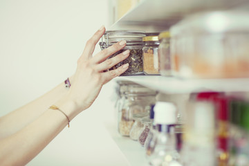 Beautiful young  woman breakfast cereals in the kitchen