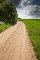 Gravel road in latvian countryside.