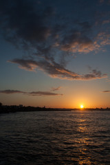 Dark silhouettes and amazing cloudy sky on sunset at tropical island in Caribbean sea