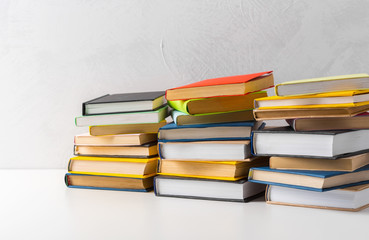  pile of paperback books on a table