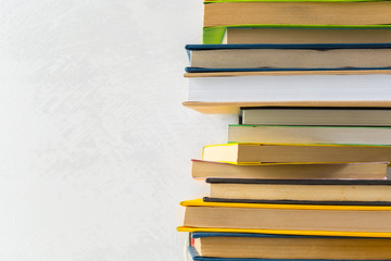  pile of paperback books on a table