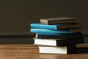 Books close up on old wooden table