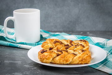 Danish pastry maple pecan with nuts and maple syrup