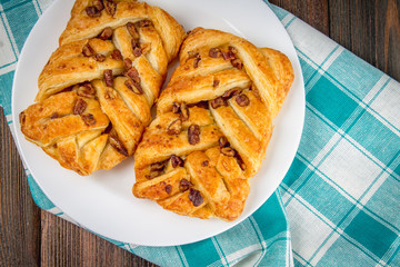 Danish pastry maple pecan with nuts and maple syrup