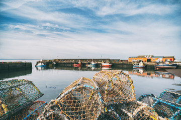 Obraz premium Lobster pots stacked onto each other in a small fishing port. Port Seaton, Scotland, UK