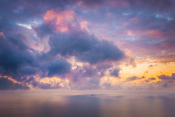 Naklejka na ściany i meble Colorful cumulus clouds at sunset over Port Phillip Bay