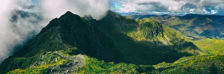 Panoramic view of the notoriously difficult Aonach Eagach mountain ridge in the Scottish Highlands....
