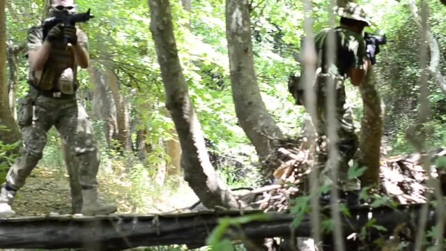Jungle commando walk on wooden brige 