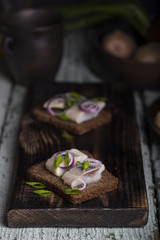snack of rye bread, herring and onions