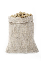 white peppercorn in sack isolated