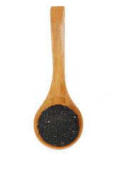  black caraway in wooden spoon isolated