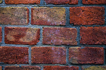 Obraz premium Brick wall of red brick. Brick masonry with smooth seams. Accurate brickwork