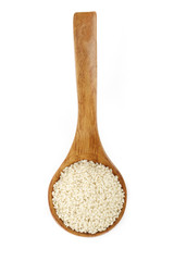 white sesame in wooden spoon isolated