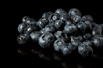 A pile of blueberries isolated on black background
