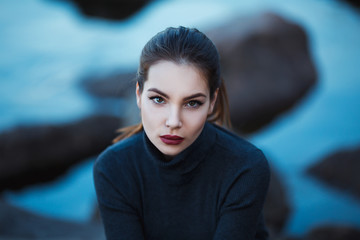 Beautiful young woman. Dramatic outdoor portrait of sensual brunette female with long hair. Sad and...