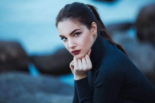 Beautiful Young Woman. Dramatic Outdoor Portrait Of Sensual Brunette Female With Long Hair. Sad And Serious Girl.