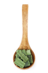 aloe vera in wooden spoon isolated