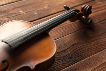 Fototapeta na wymiar Violin on a wooden textured table