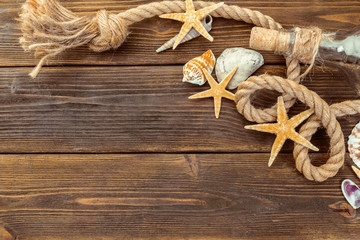 Seashells border on wood. Marine background
