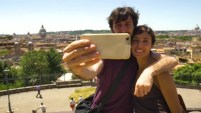 Young Couple Taking Selfie with Rome Cityscape