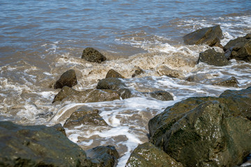 Muddy waves after а storm, the Black Sea, Poti, Georgia