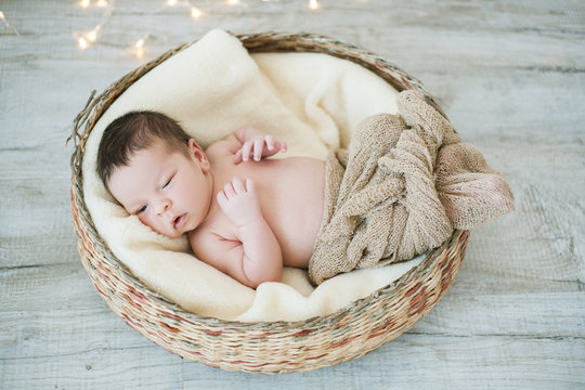 Newborn Baby Lying In Basket