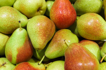 Fresh ripe multi-colored pears in a box