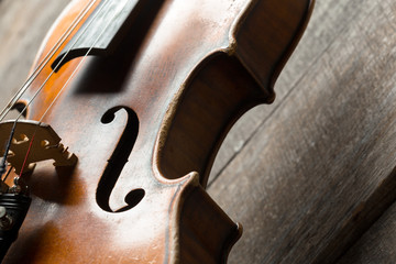 Violin on a wooden textured table