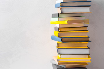  pile of paperback books on a table