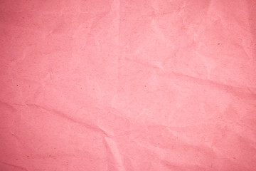 Crumpled recycle pink paper background.