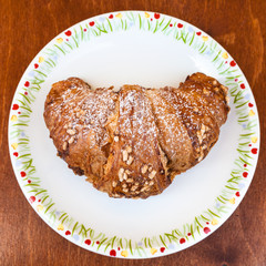 top view of croissant filled by chocolate on table