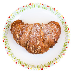 top view of croissant filled by chocolate on plate
