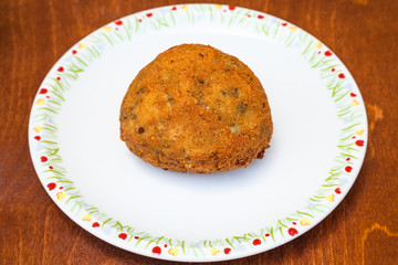 vegetable stuffed rice ball arancini on table