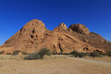 Fototapeta na wymiar Spitzkoppe, aka Sptizkop - unique rock formation in Damaraland landscape, Namibia, Africa.