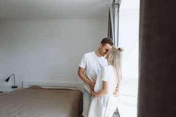 Beautiful pregnant woman and her handsome husband