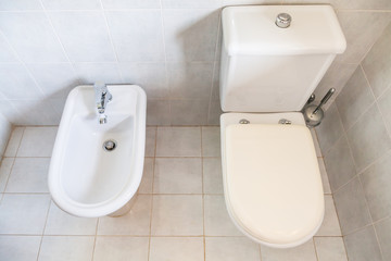 Fototapeta premium white toilet with bowl drain and bidet