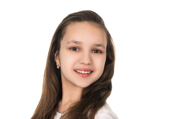 portrait of beautiful teenage girl on white background, isolated. amazing brunette woman smiling and looking into the camera, beauty and fashion