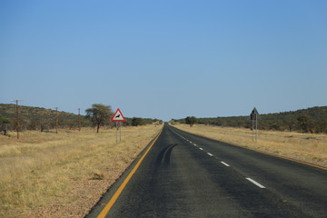 Warning sign with gazelle symbol on the road to Etosha National Park, Namibia, Africa.