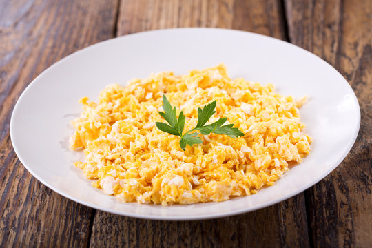 plate of scrambled eggs with parsley