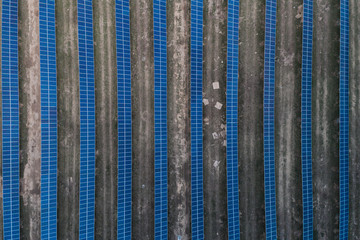 Series of solar cells located on the field in the suburbs. Aerial view. Alternative sources of energy.