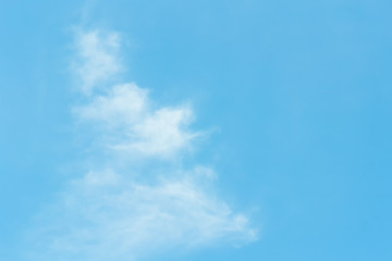 The blue backdrop has some clouds.