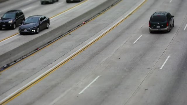 BUSY URBAN FREEWAY SHOT IN TILT SHIFT EFFECT