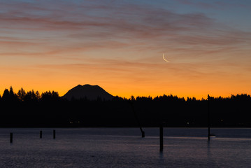 new moonrise over mt rainier